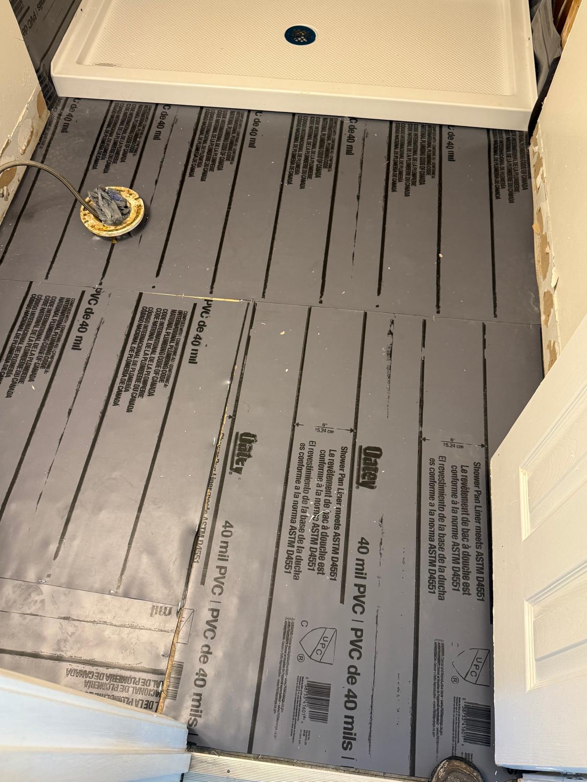 40-mil PVC shower pan liner installed