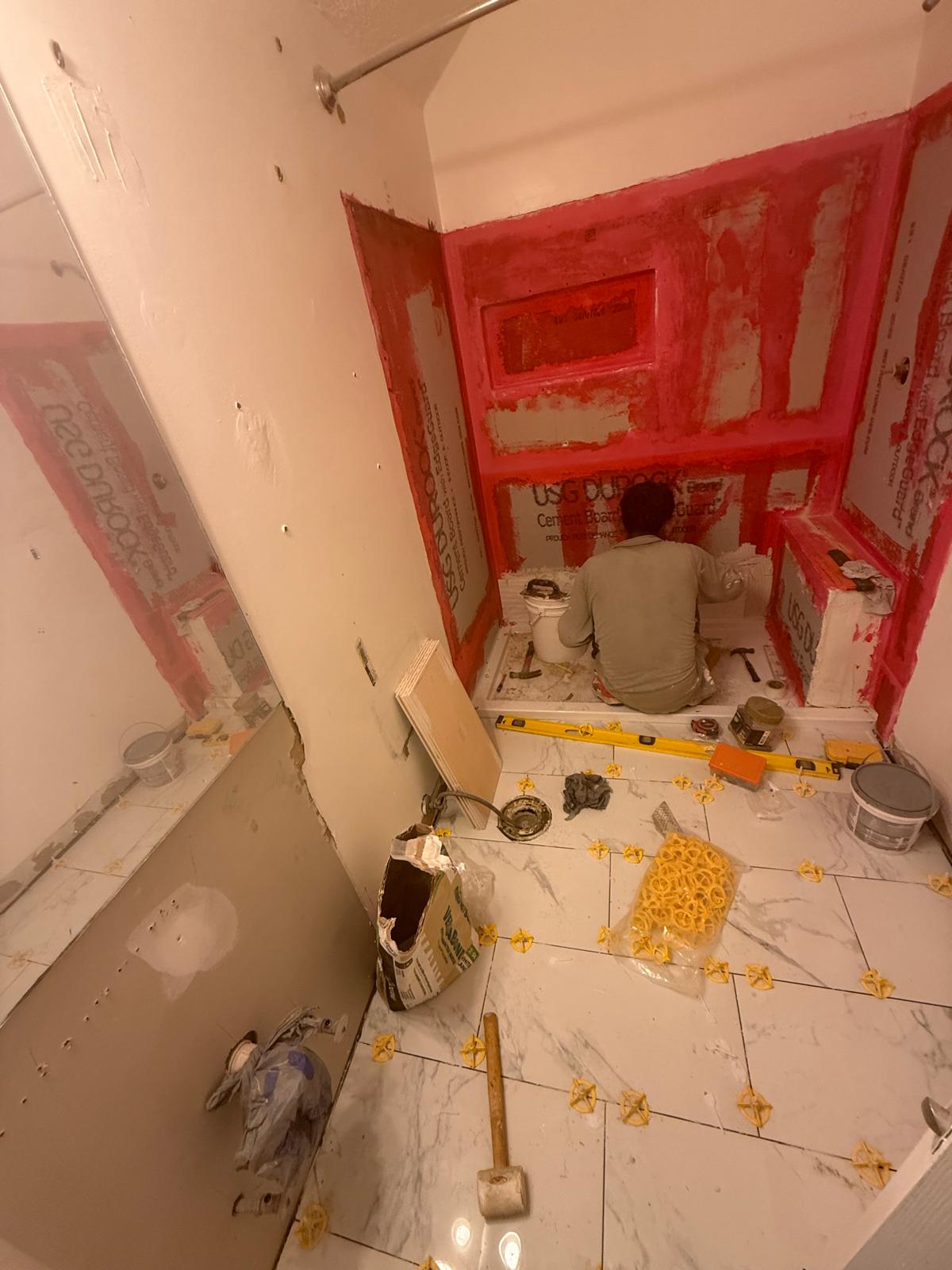 Liquid waterproofing membrane on cement board before tile
