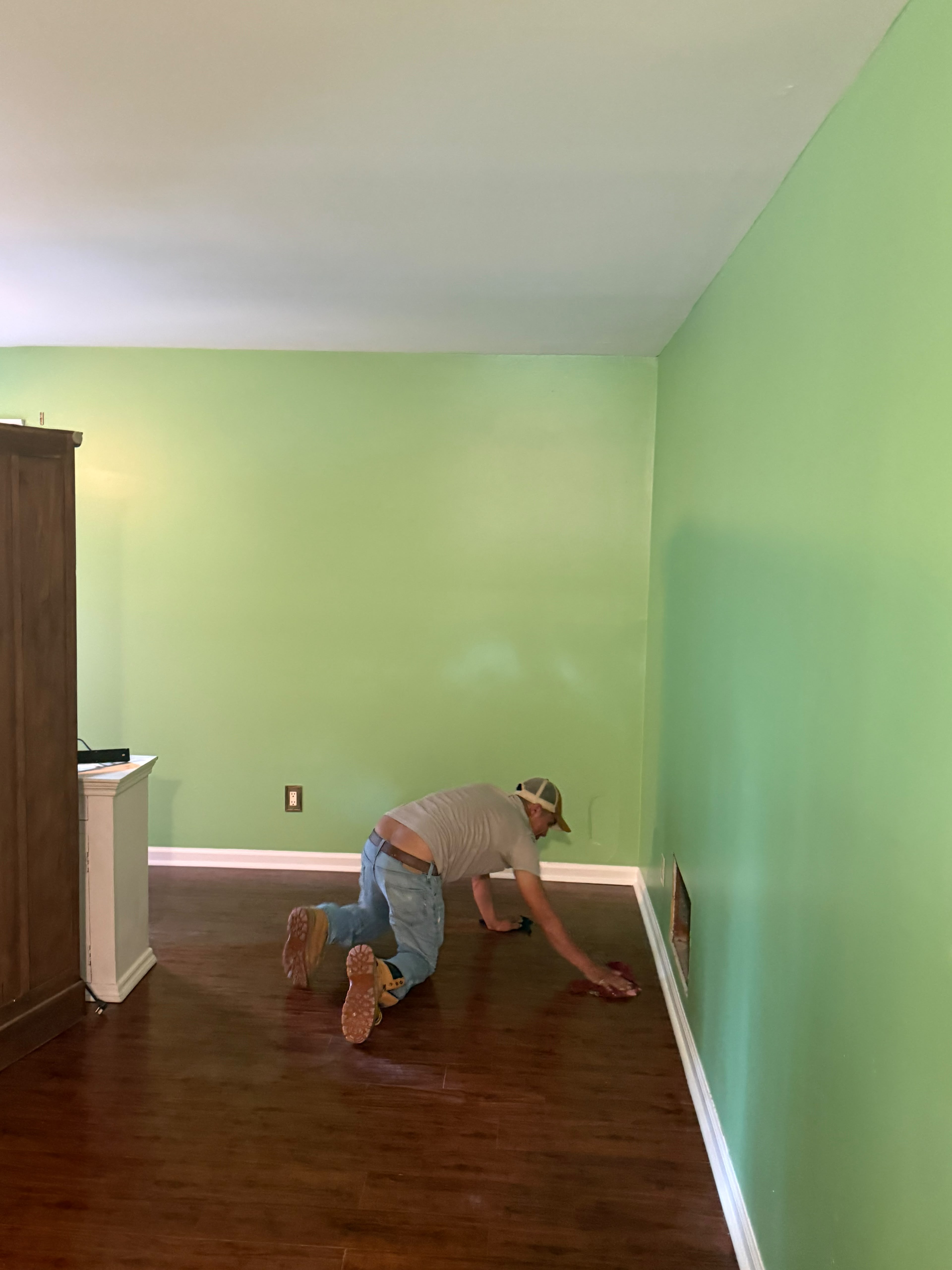 Bedroom after repaint with fresh baseboards